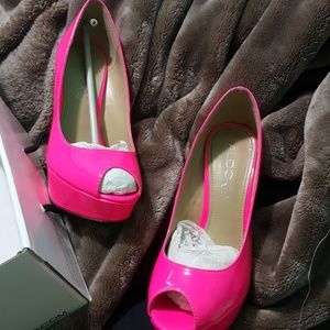 Neon pink peep toe pumps